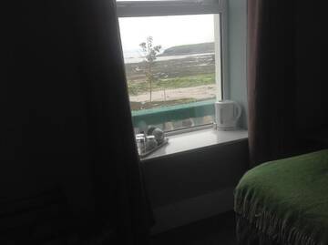 Фото номера Трехместный номер с видом на море Гостевой дом Rolling Wave Guesthouse г. Бандоран 16