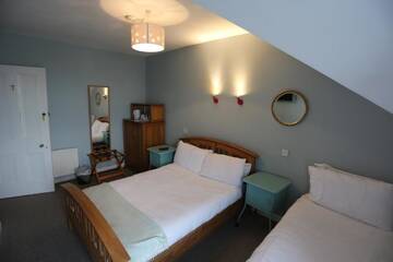 Фото номера Трехместный номер с видом на море Гостевой дом Rolling Wave Guesthouse г. Бандоран 4