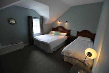 Фото номера Трехместный номер Гостевой дом Rolling Wave Guesthouse г. Бандоран 2