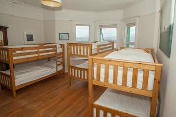 Фото номера Односпальная кровать в общем номере для женщин Хостелы TurfnSurf Lodge г. Бандоран 6